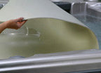 Gladon 1/4 inch thick foam floating spa CoverSaver resting on hot tub water